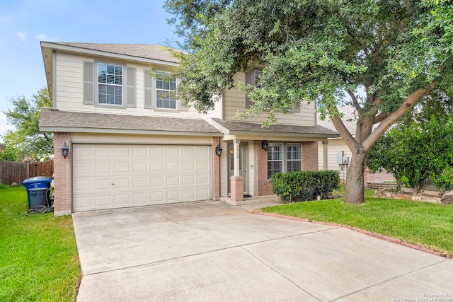 view of front of house with a front lawn and a garage