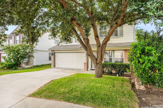 view of front facade with a front lawn and a garage