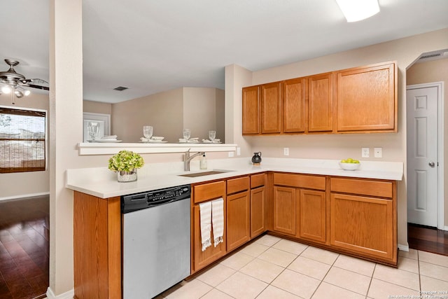 kitchen featuring ceiling fan, sink, light tile patterned floors, and dishwasher