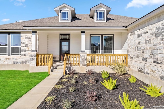 view of front of property with a front lawn and a porch