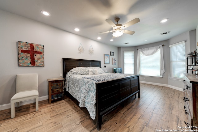 bedroom with light wood-type flooring and ceiling fan