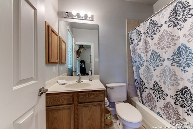 full bathroom with shower / tub combo with curtain, vanity, and toilet