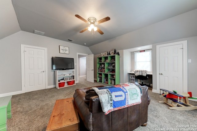 living room with carpet, ceiling fan, and vaulted ceiling