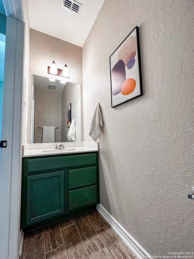 bathroom featuring vanity and a textured ceiling