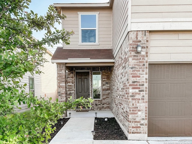 property entrance with a garage