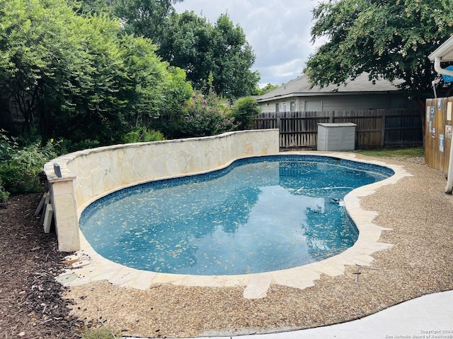 view of pool featuring fence and a fenced in pool