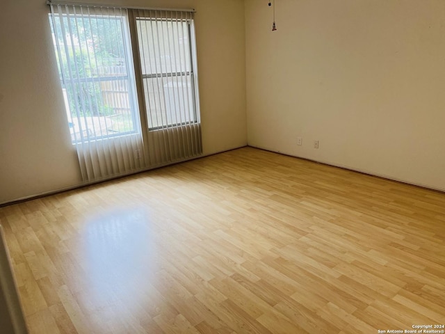 empty room featuring wood finished floors