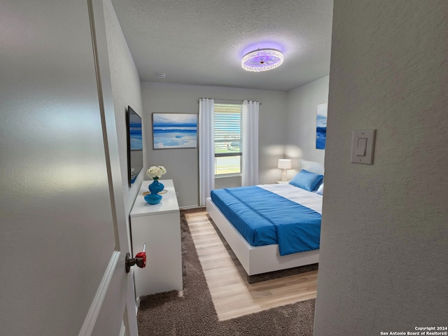 bedroom featuring a textured ceiling