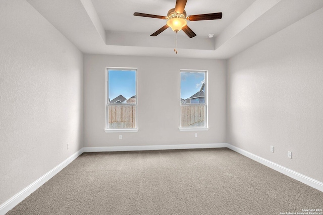 213 Fillmore Fls, Cibolo, TX 78108 - carpeted empty room with a raised ceiling, a ceiling fan, and baseboards