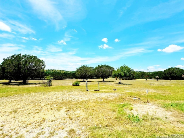 view of yard with a rural view