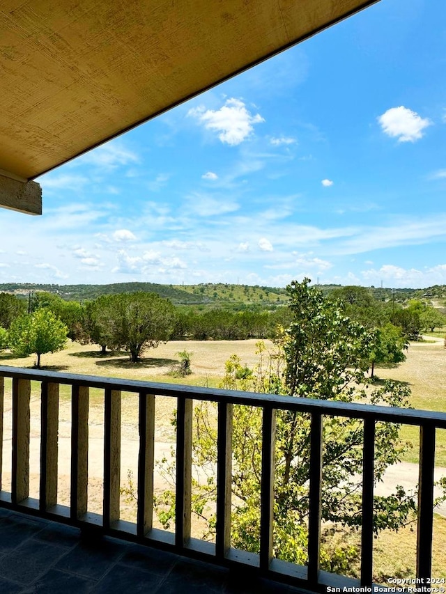 balcony featuring a rural view