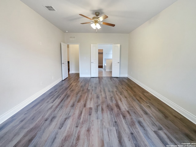 unfurnished bedroom featuring dark hardwood / wood-style flooring and ceiling fan