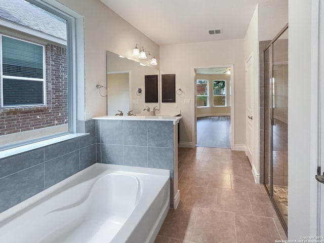 bathroom featuring shower with separate bathtub, tile patterned floors, vanity, and ceiling fan