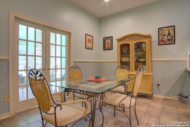 dining room with french doors, tile patterned flooring, and plenty of natural light