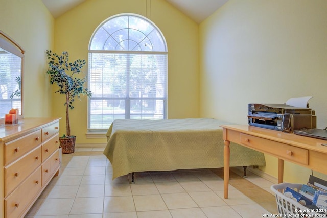 bedroom featuring light tile patterned flooring and vaulted ceiling