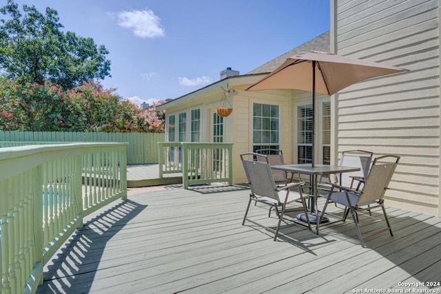 wooden deck with outdoor dining space