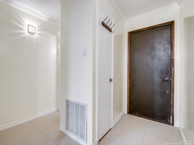 hall with light tile patterned flooring and ornamental molding