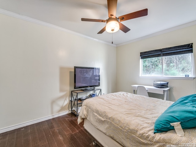 bedroom featuring crown molding, dark hardwood / wood-style floors, and ceiling fan