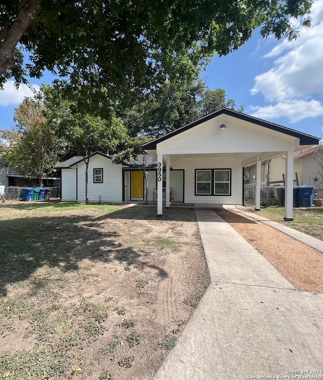 single story home with a carport