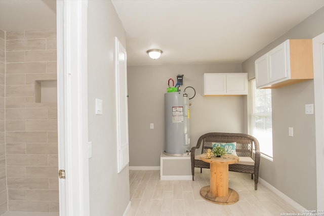 interior space with water heater and baseboards