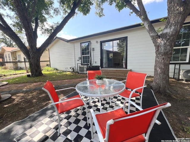 view of patio / terrace featuring fence and outdoor dining area