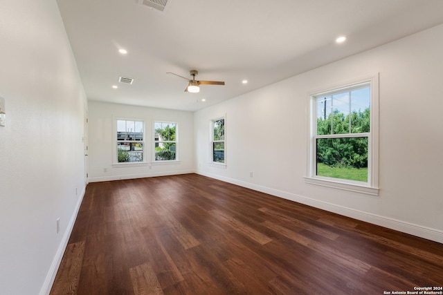 unfurnished room featuring ceiling fan and dark hardwood / wood-style flooring