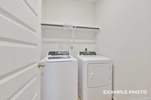 clothes washing area featuring washing machine and clothes dryer