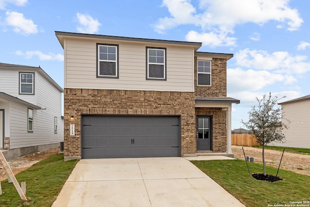 front facade featuring a garage and a front lawn