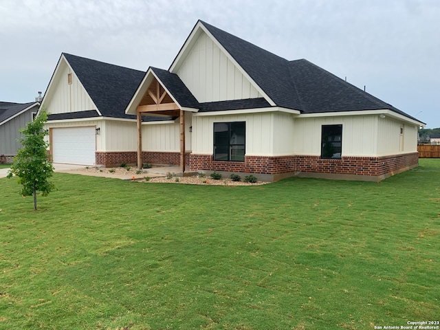 view of front of home with a garage and a front yard