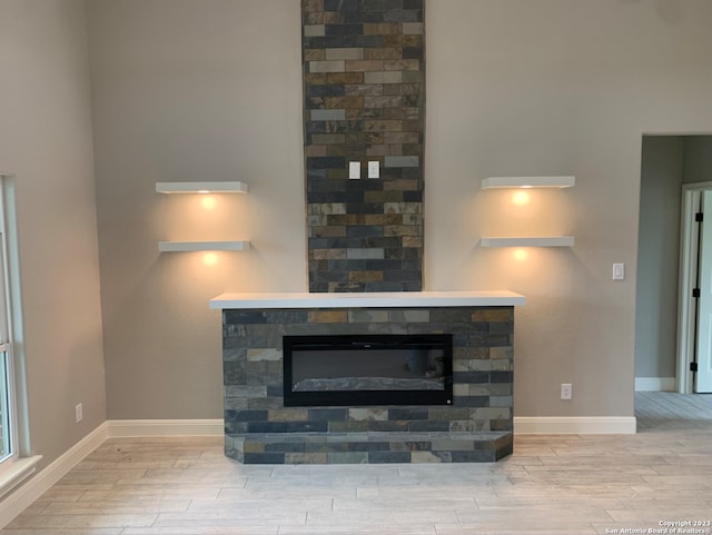 interior details with a fireplace and wood-type flooring