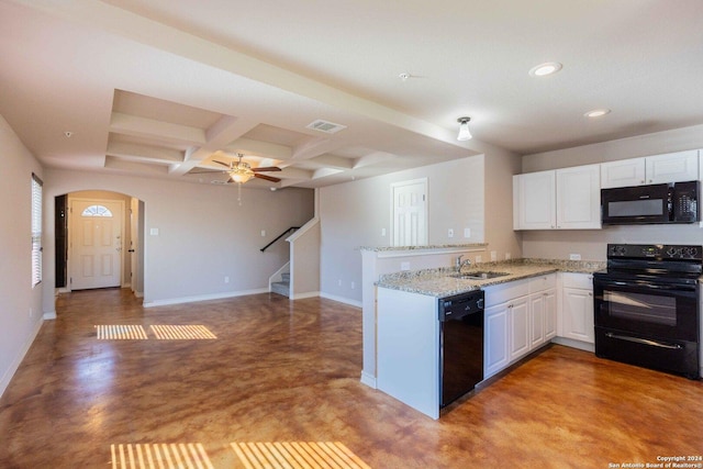 kitchen featuring white cabinetry, concrete floors, black appliances, and coffered ceiling