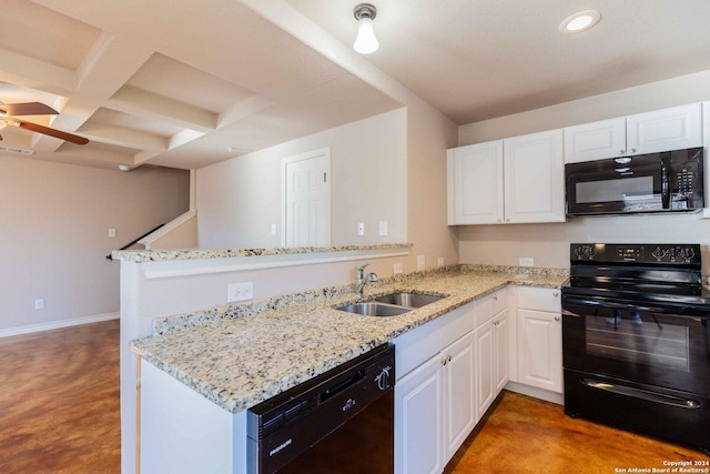 kitchen with kitchen peninsula, sink, white cabinets, and black appliances