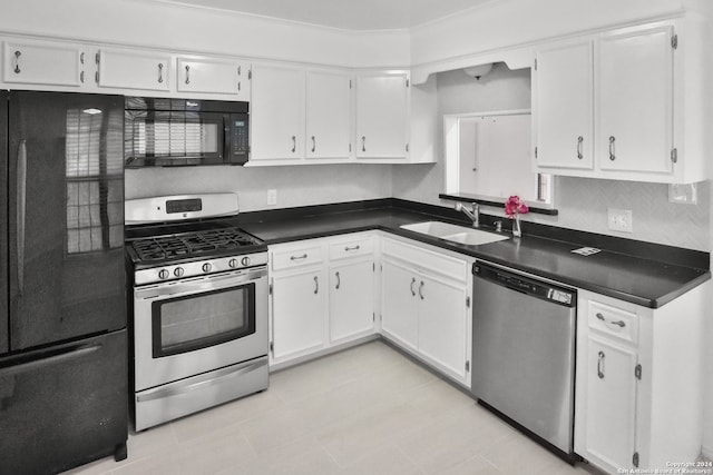 kitchen with light tile patterned flooring, sink, black appliances, and white cabinetry