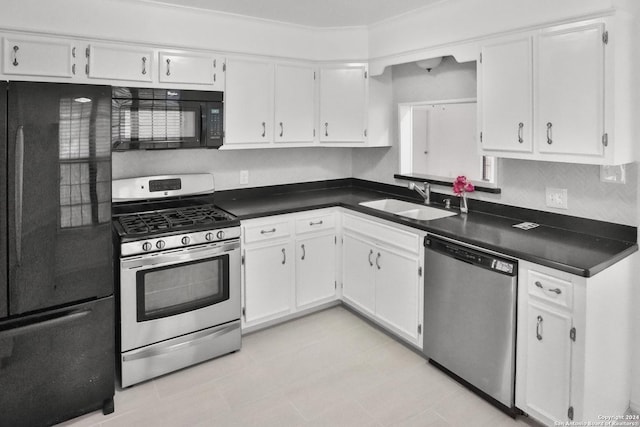 kitchen featuring white cabinetry, sink, and black appliances