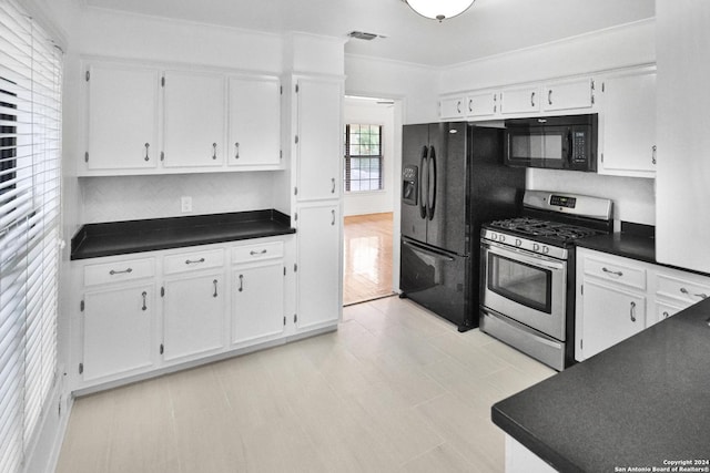 kitchen with crown molding, black appliances, and white cabinets