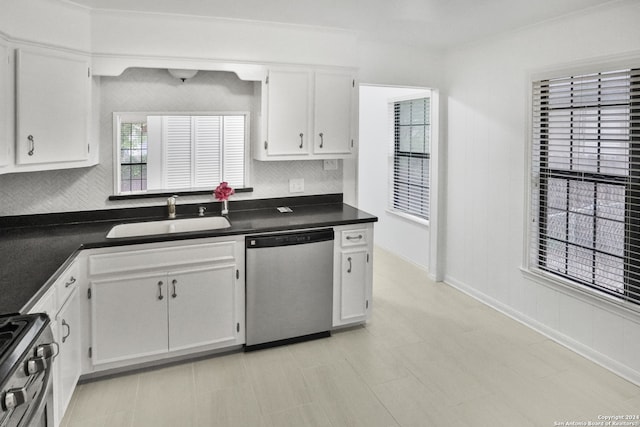 kitchen featuring white cabinets, dishwasher, range, and decorative backsplash