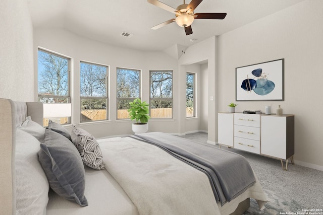 carpeted bedroom with lofted ceiling and ceiling fan