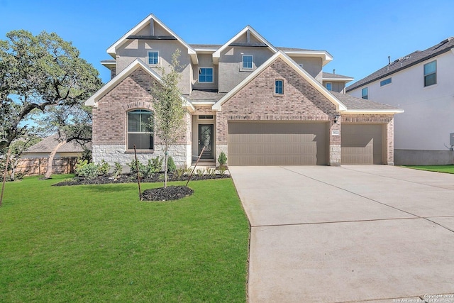 view of front of house with a front yard and a garage