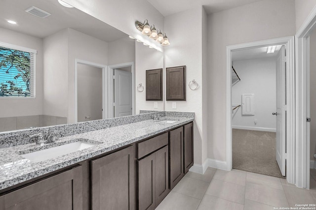 bathroom with vanity and tile patterned flooring