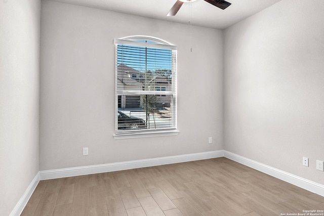 unfurnished room featuring ceiling fan and light hardwood / wood-style floors