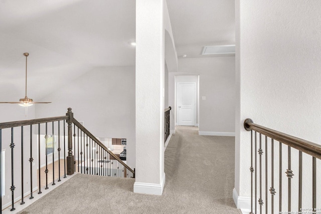 hall featuring lofted ceiling and carpet floors