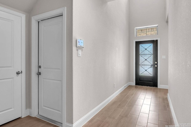 entrance foyer featuring vaulted ceiling