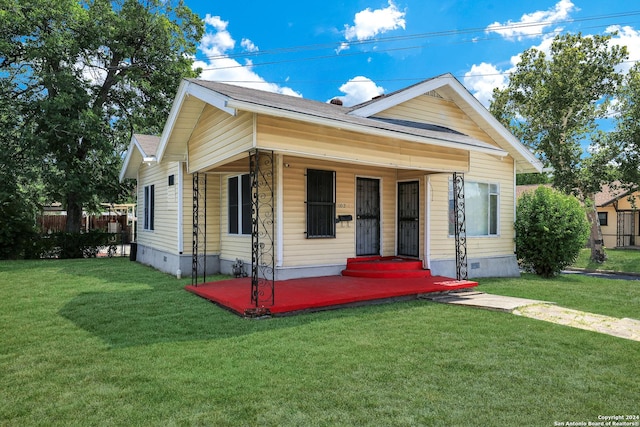 bungalow with a front yard