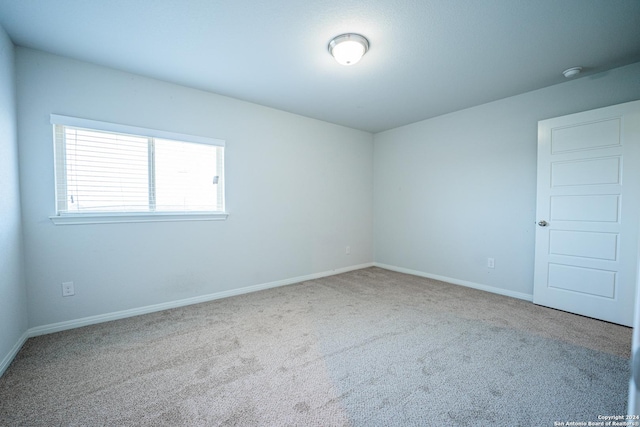 empty room featuring carpet flooring