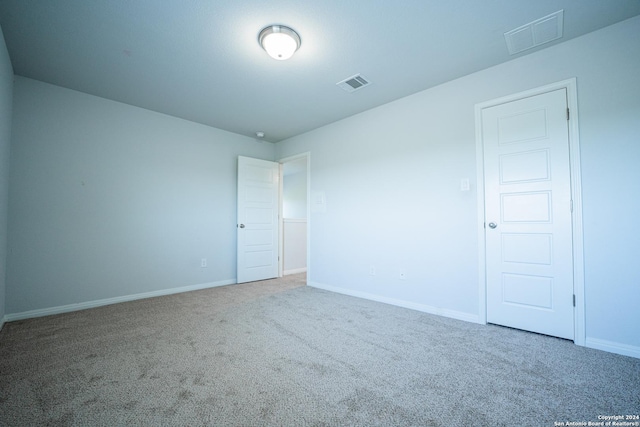 empty room with carpet flooring