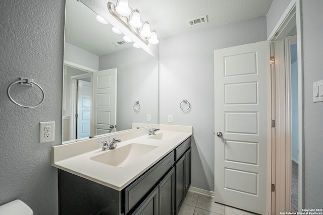 bathroom with vanity and tile patterned floors