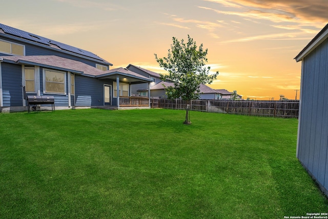 view of yard at dusk