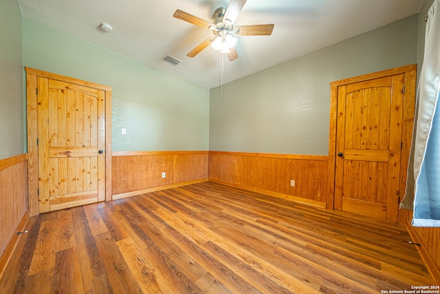 empty room featuring wood-type flooring and ceiling fan