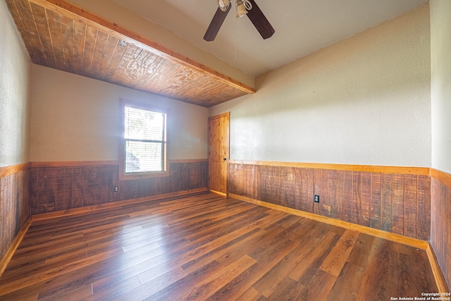 spare room with ceiling fan and dark hardwood / wood-style floors