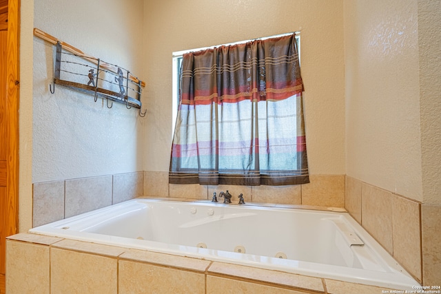 bathroom with a relaxing tiled tub